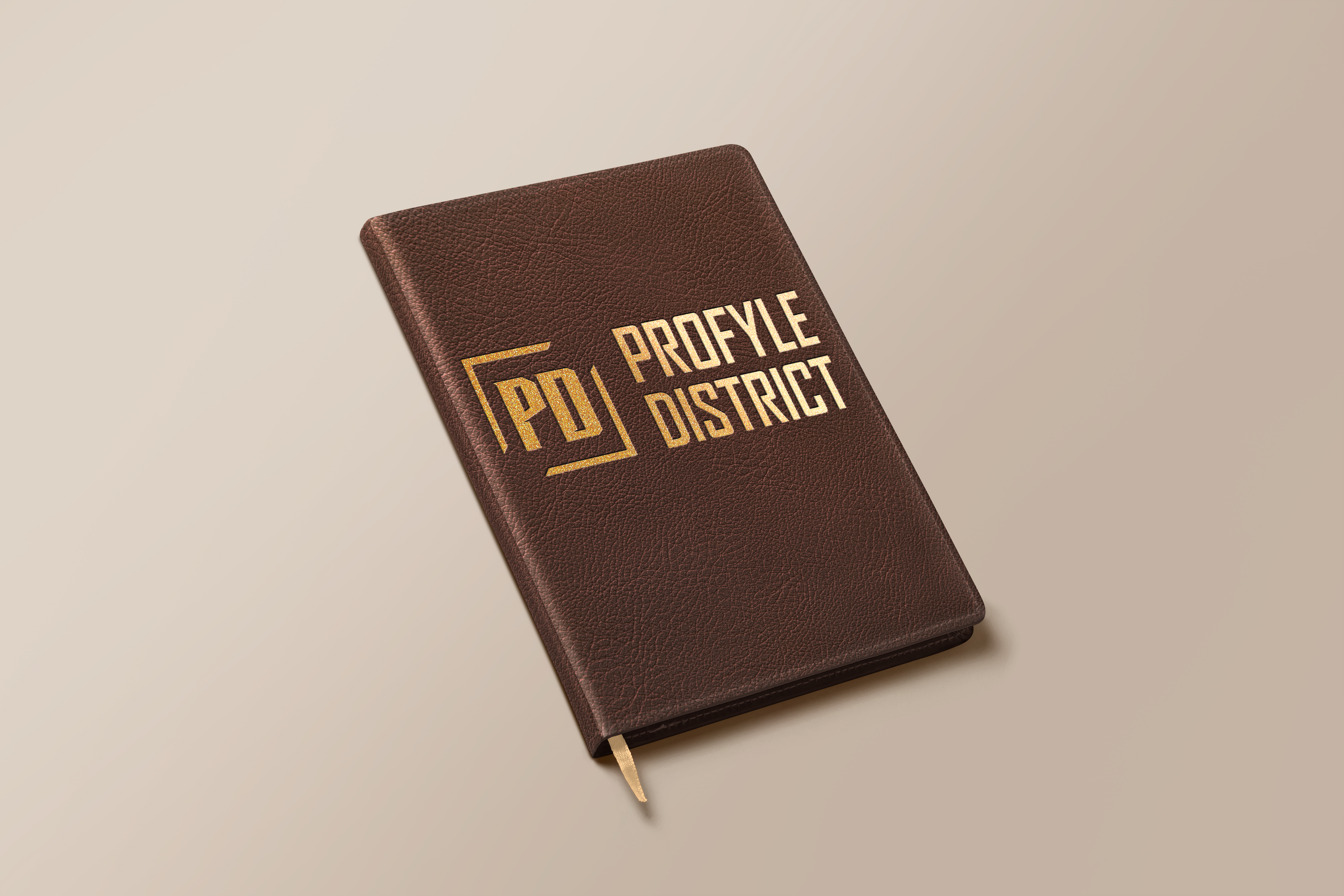 Brown notebook with 'Proflye District' branding on a beige background