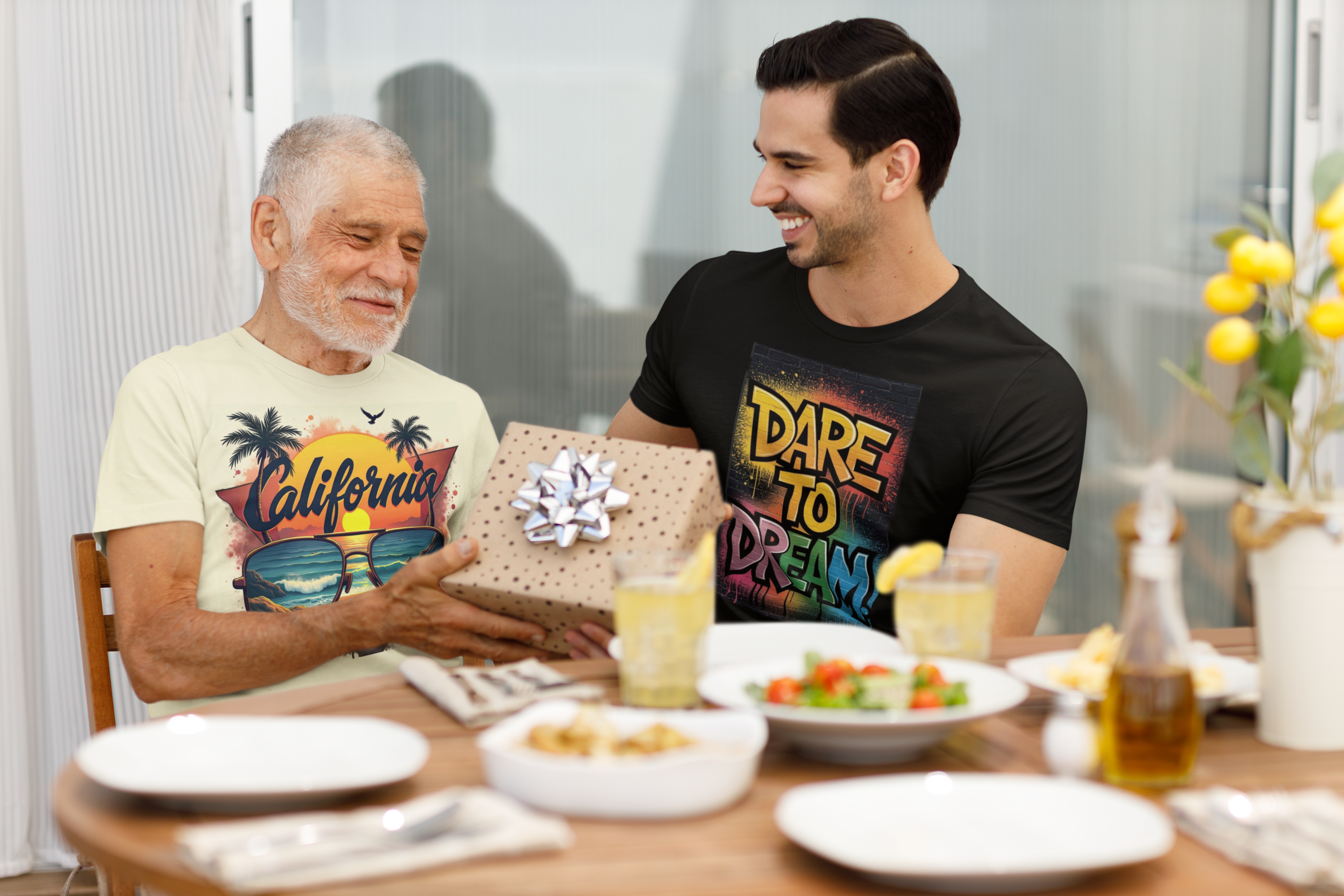 Two men sitting at a table with a gift, engaged in conversation.